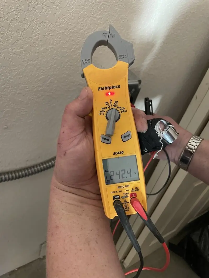Voltage testing with clamp meter during Electrical Installation Services in Washington Terrace
